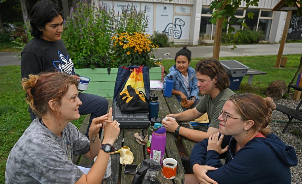 Students at a table in the Sprout Garden
