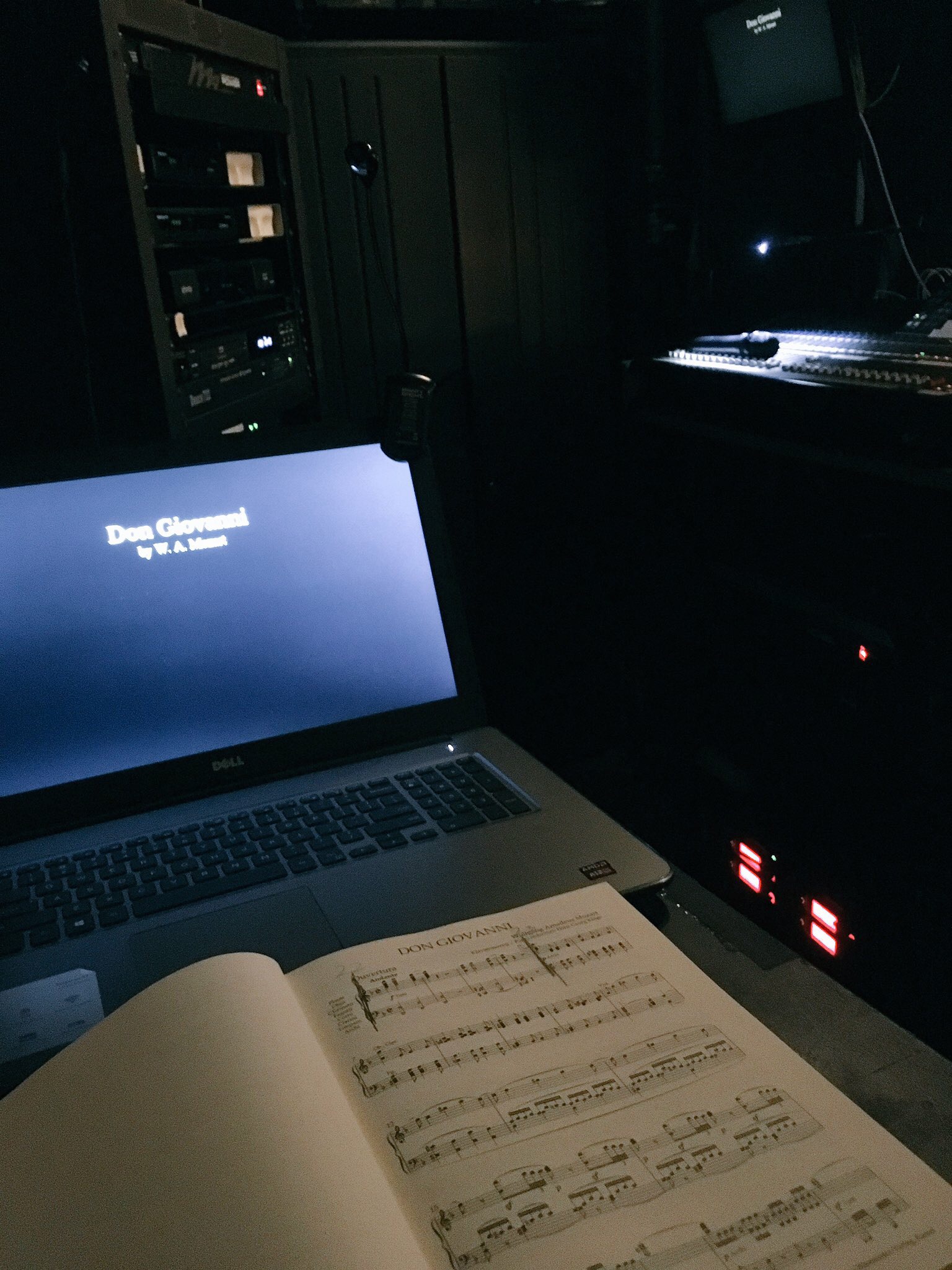 Saadya lays out the music for Don Giovanni in front of his open macbook laptop, ready to transcribe the lyrics