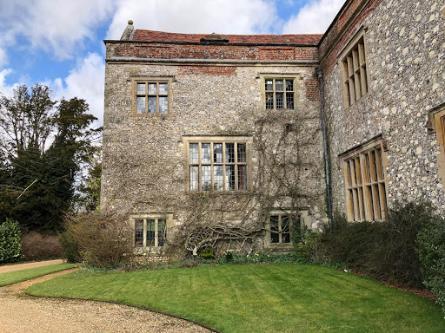  A photo of the outside of Chawton house, a stone building with a red roof that was Jane Austen’s brother’s estate