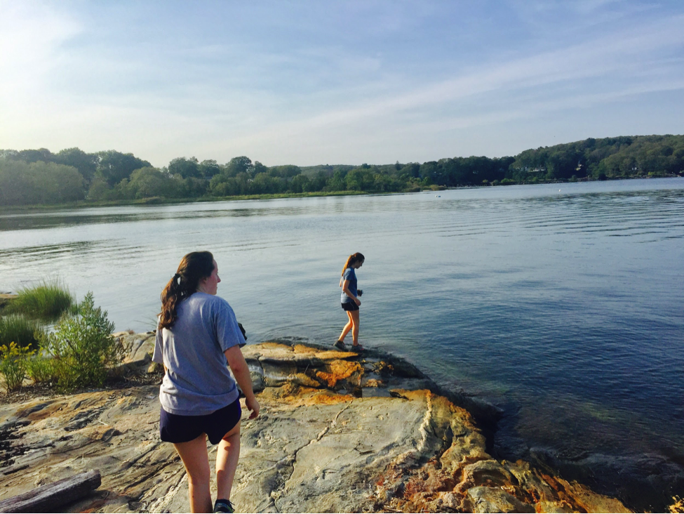 Avery Lowe ’18 explores the water's edge at Mamacoke Island.
