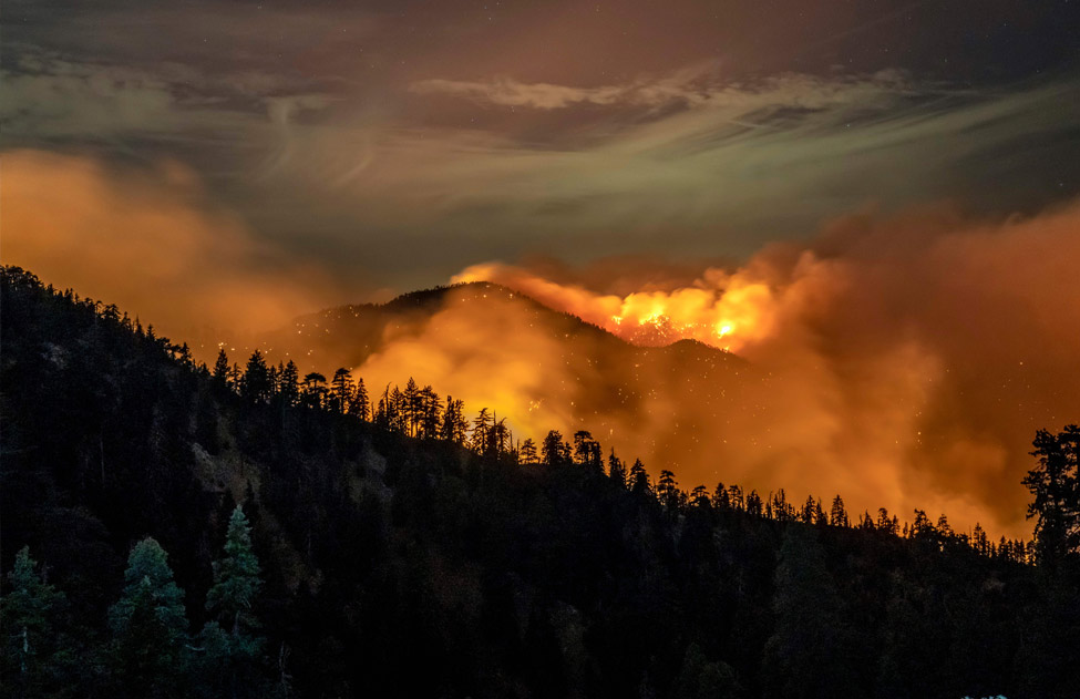 Photo of California wildfires burning in the mountains