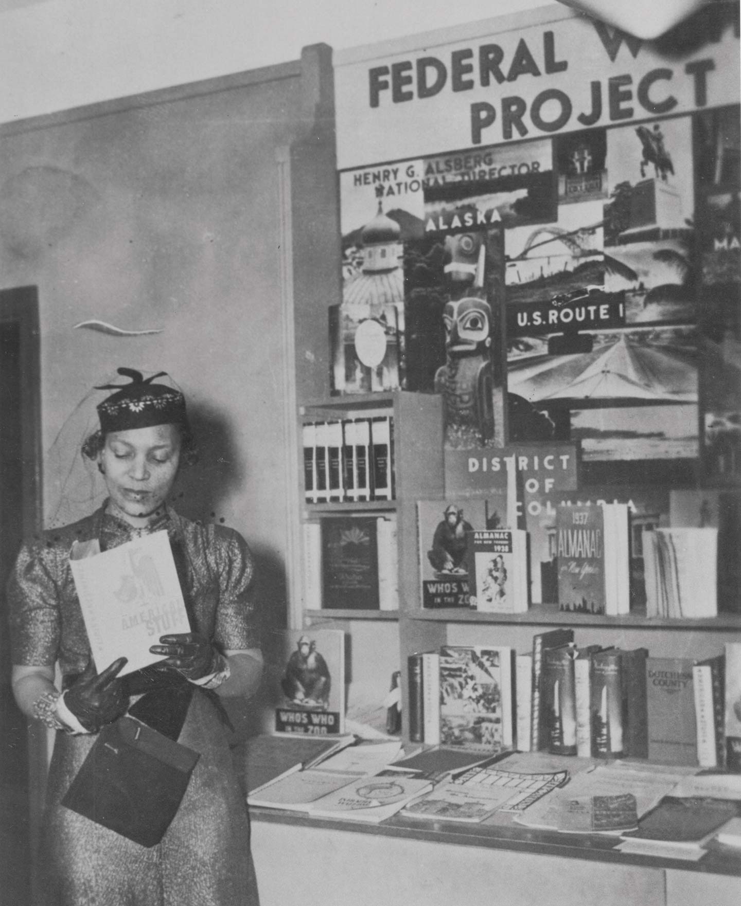 Zora Neale Hurston examining a copy of American Stuff at the New York Times Book Fair in fall 1937