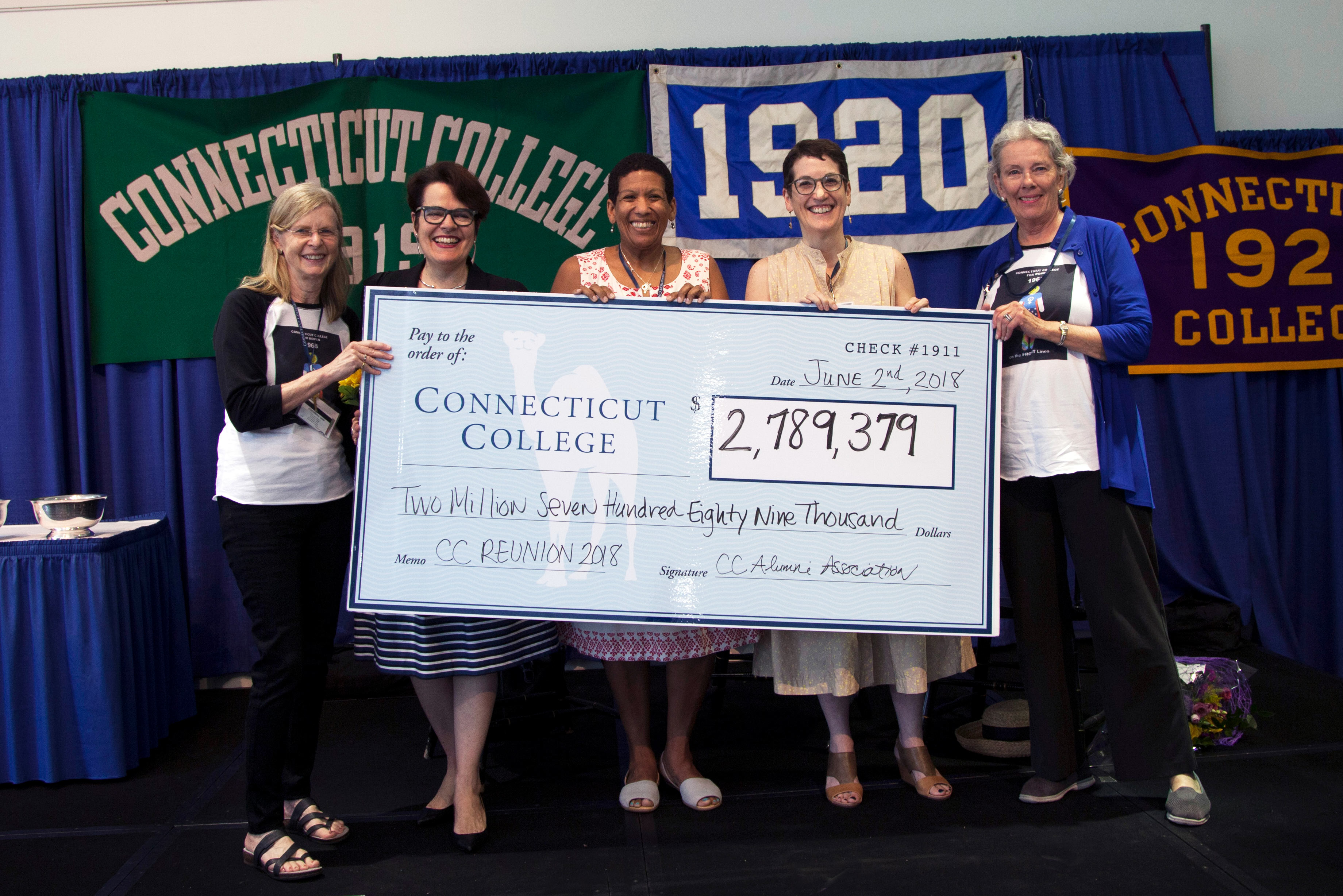 Alums hold giant Reunion giving check with President Bergeron at Reunion 2018