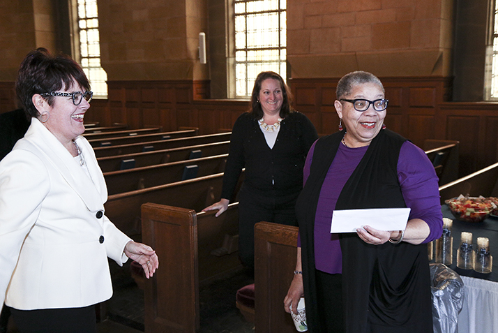 Rev. Claudia Highbaugh reacts as she learns she has won a staff award