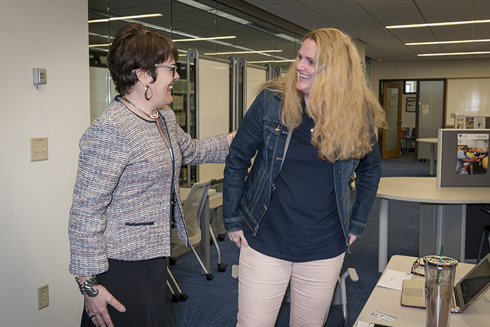 President Katherine Bergeron surprises Patricia Dallas, assistant director of the Academic Resource Center, with the Citizenship Award. 