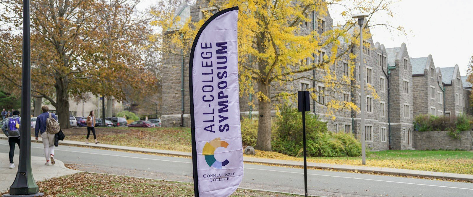 An All College Symposium banner on campus