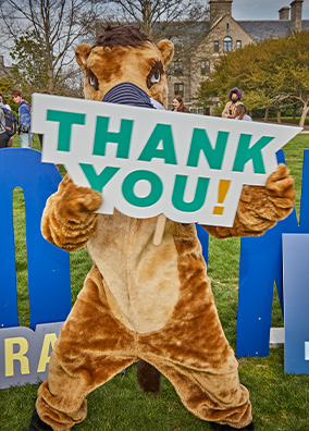 The Camel mascot with a thank you sign