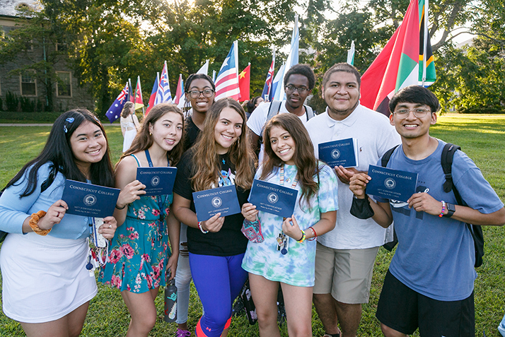 Students pose with their Convocation programs.