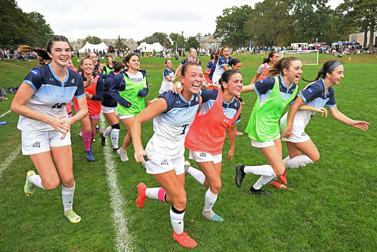 Womens soccer celebrates a goal at Fall Weekend 2023.