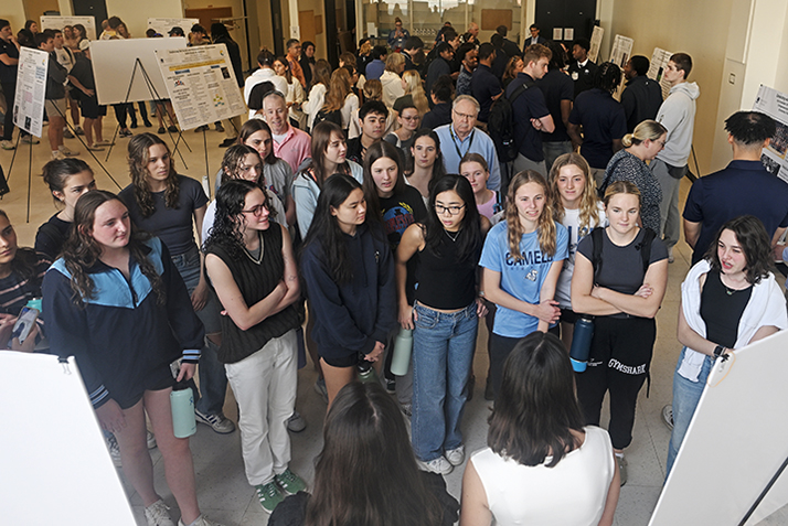 Students, faculty and staff attend a Social Justice and Sustainability poster session in Cummings Arts Center.