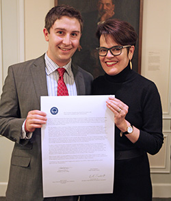 SGA President Evert Fowle '14 (left) and President Katherine Bergeron with a copy of the College's shared governance covenant.